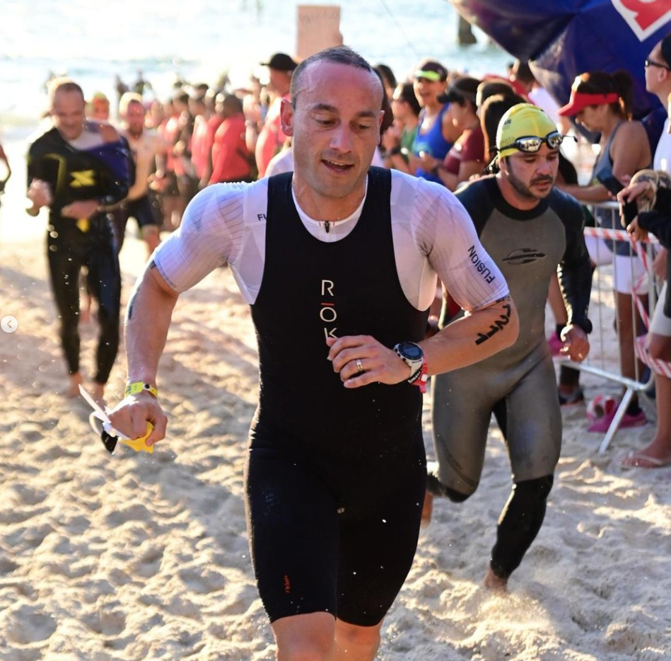 Jason leaving the water during a triathlon